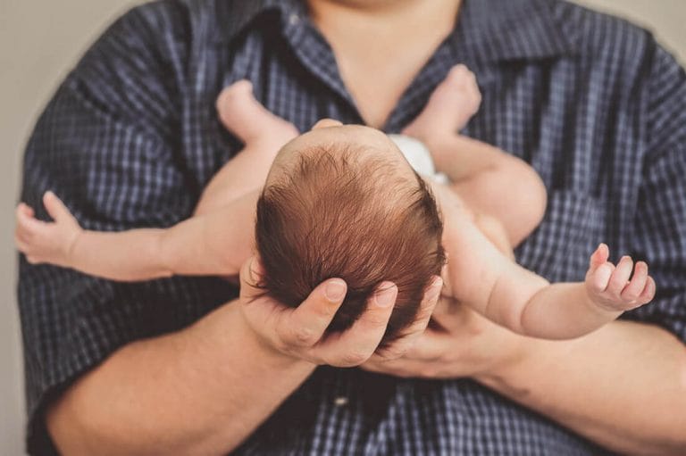 Baby in Dad's hands