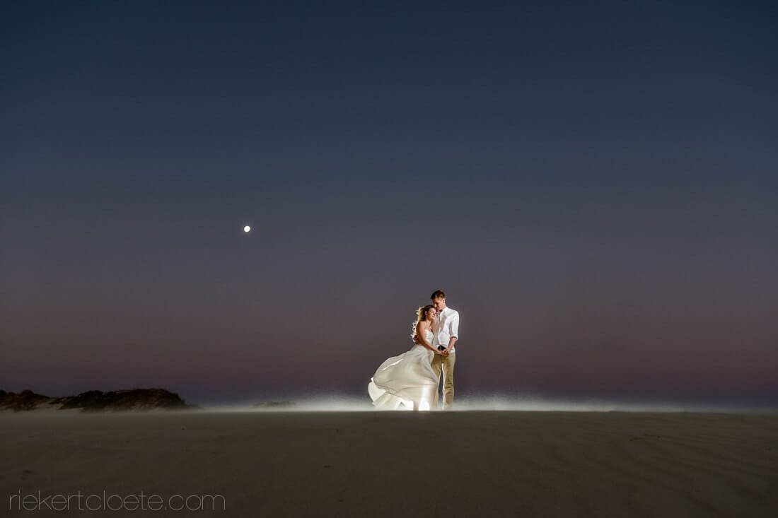 Couple on beach at night