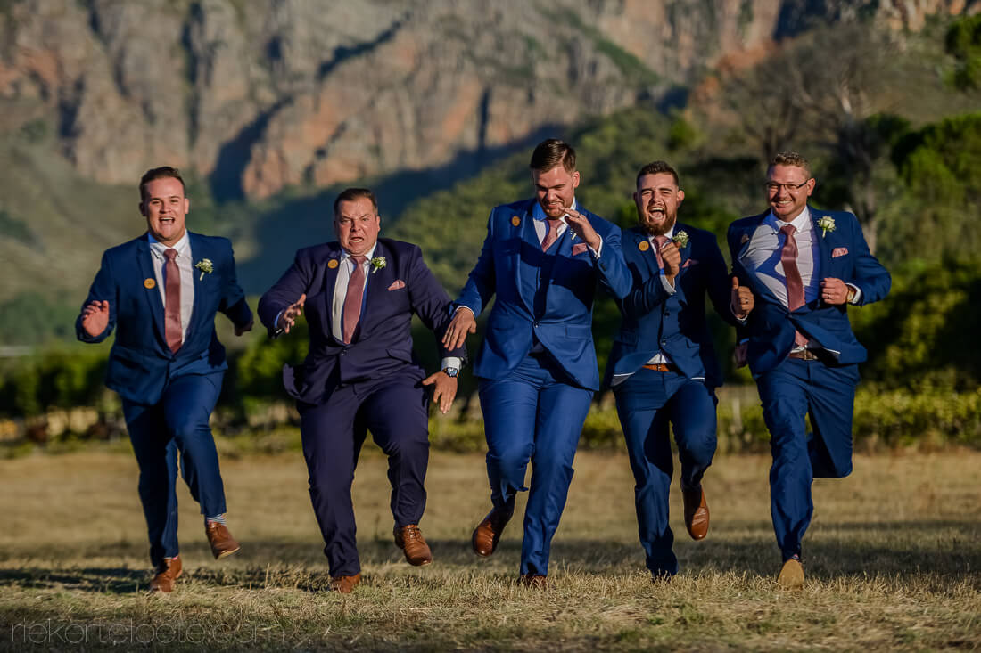 Boys running at wedding