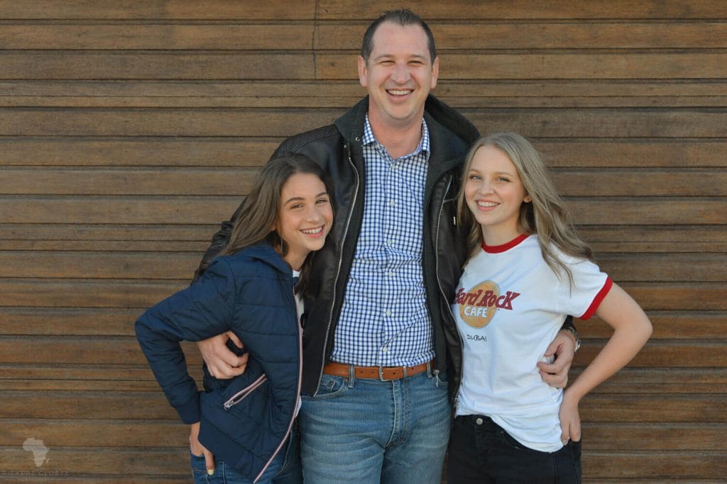 Dad and Daughters standing