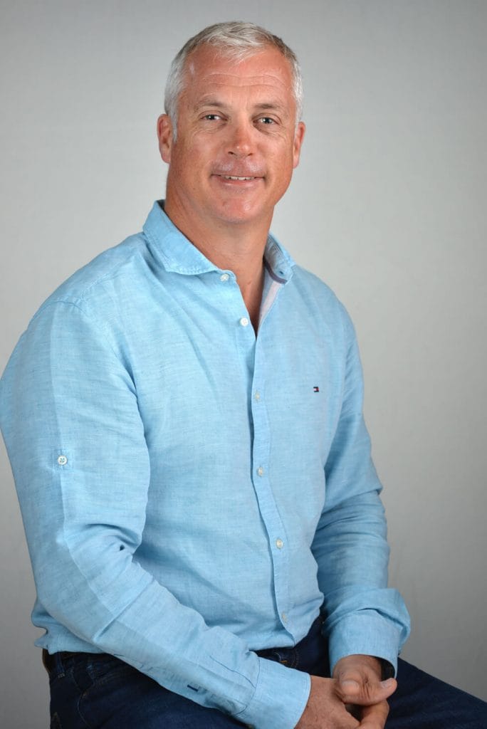 Headshot SG man with blue shirt