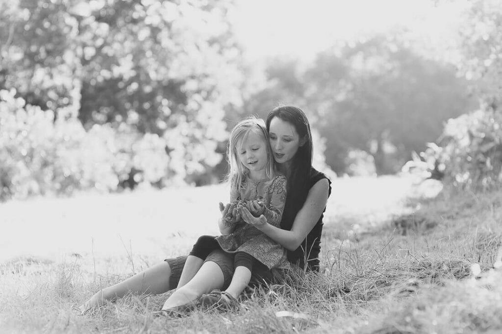 Mom and daughter kiss