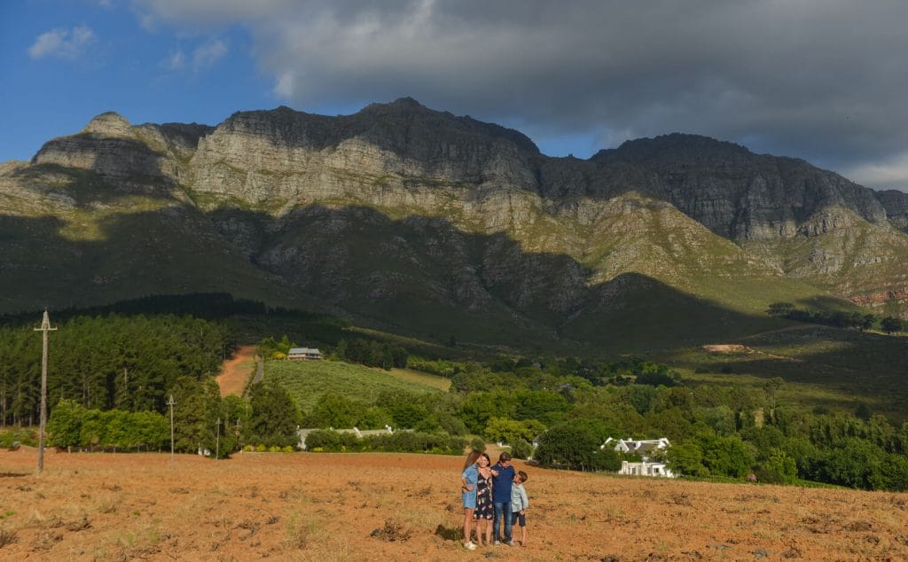Family with mountain in backdrop