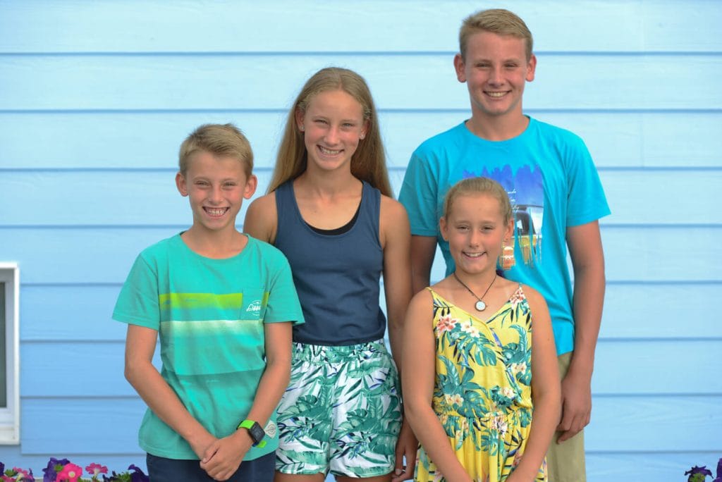 Kids in front of wall