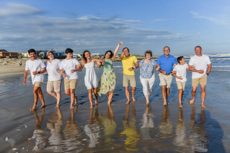 Family on beach running