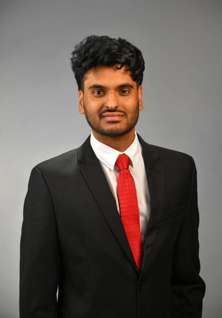 Black jacket with red tie