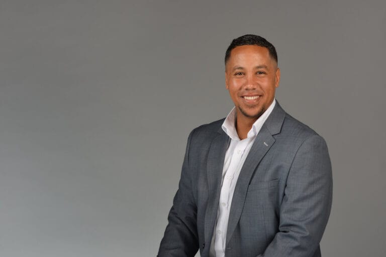 Man getting headshot done with grey background