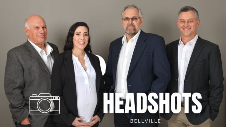 Four staff members standing during headshot session