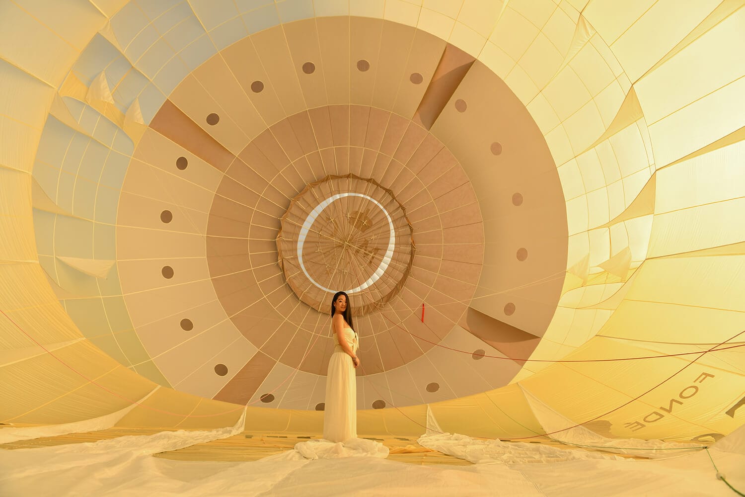 Girl in Big yellow air balloon at event