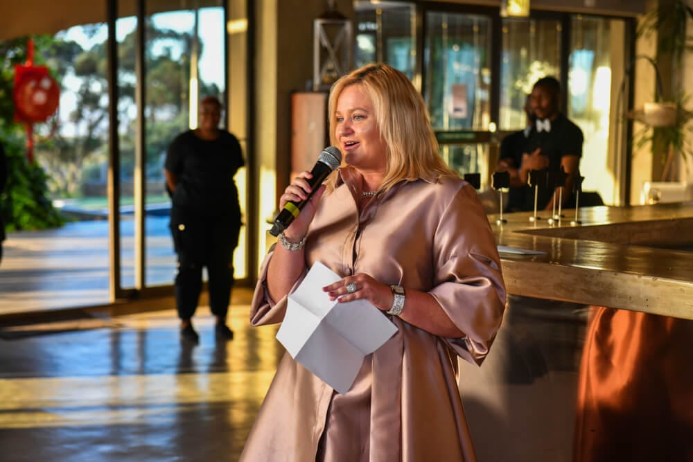 Lady talking at end of year function