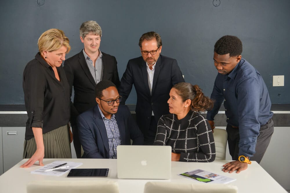 Meeting by office workers being photographed