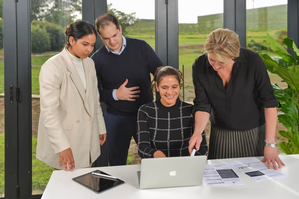 Staff looking at computer photography
