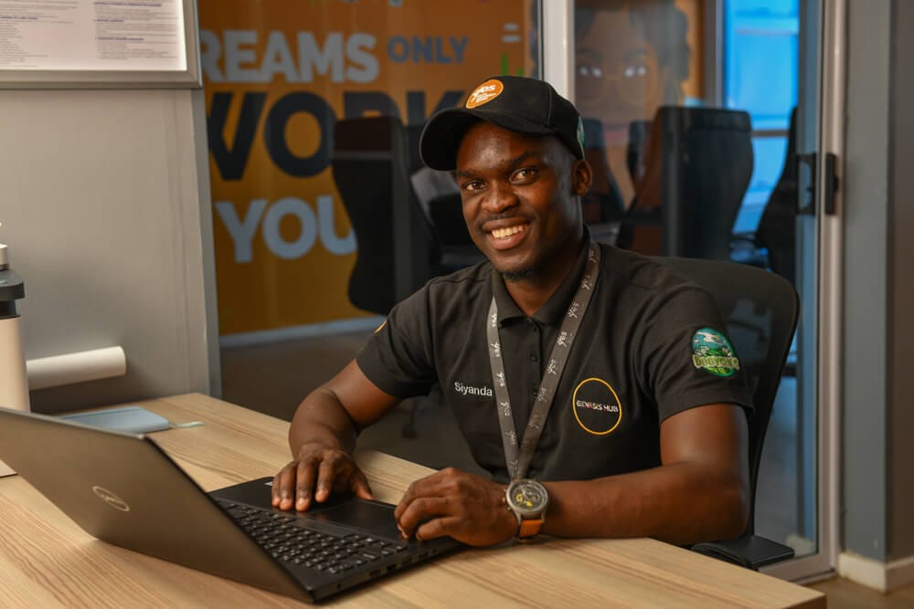 Man laughing at desk