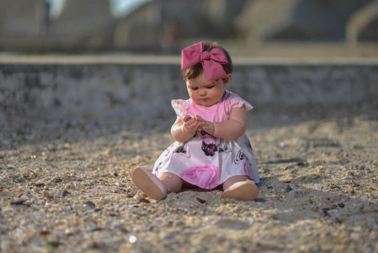 Daughter sitting on sand