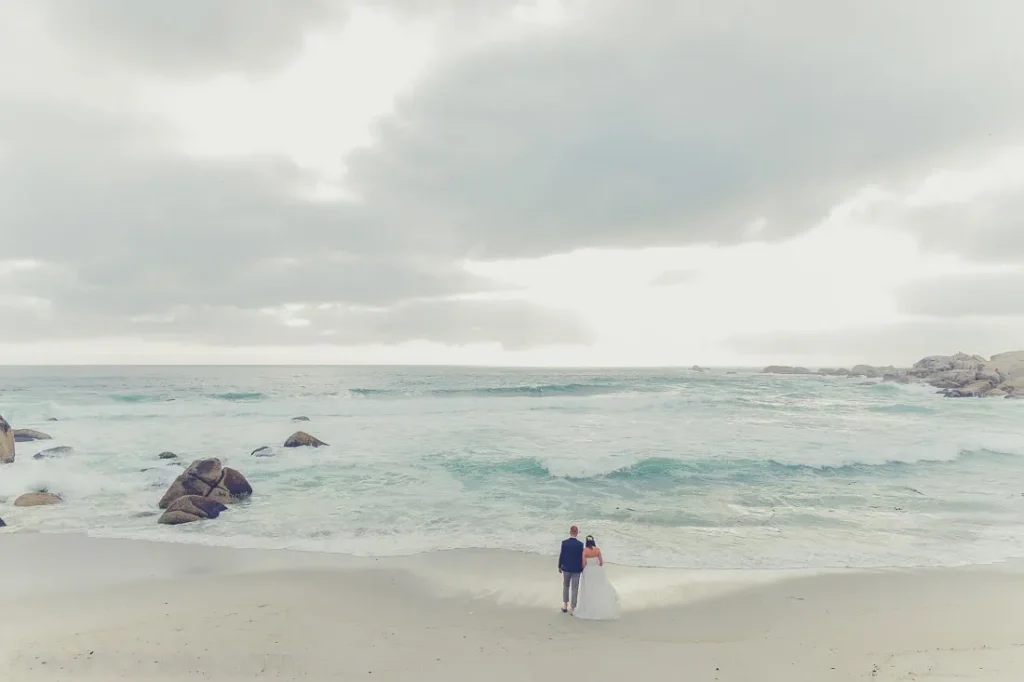 cape town elopement couple beach stormy ocean waves