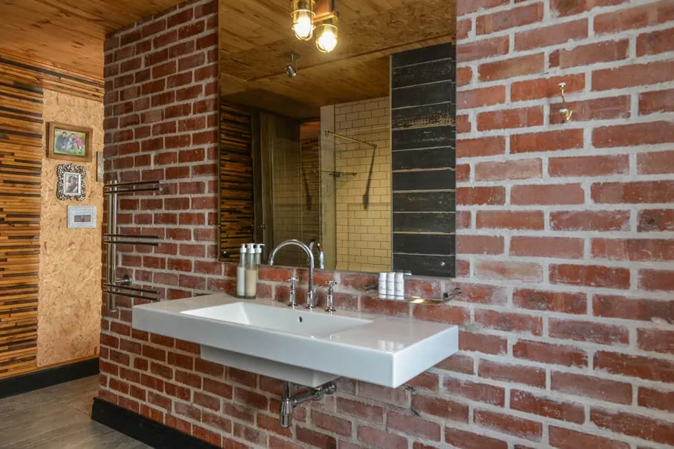 industrial bathroom exposed brick pendant lighting interior photography western cape
