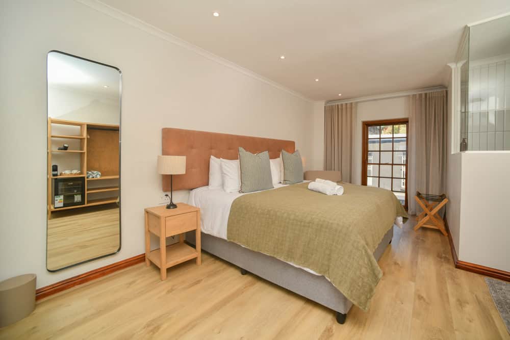 modern bedroom leather headboard wooden wardrobe interior photography cape town
