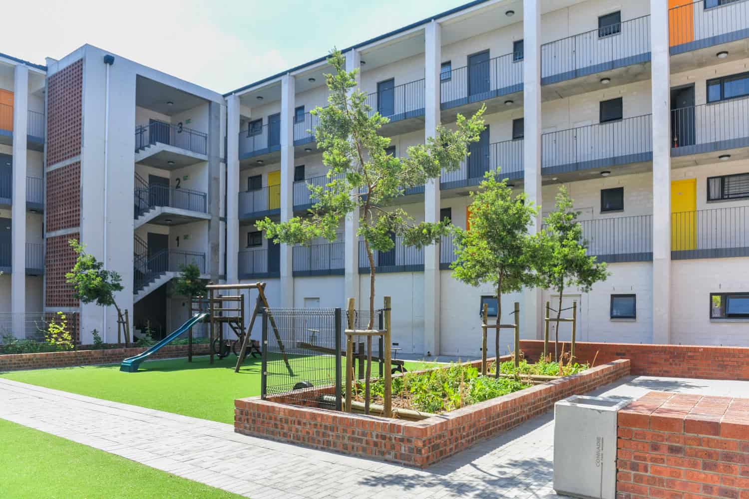 multi storey white brick urban apartment architectural photography cape town