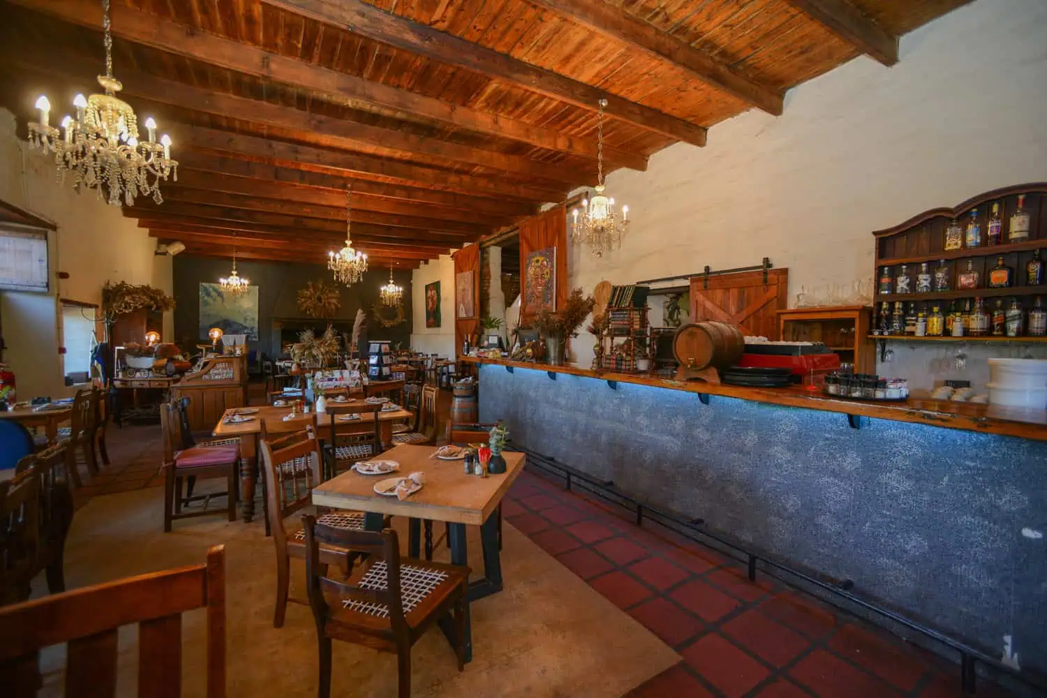 rustic restaurant timber beams chandeliers wine bar interior photography cape town