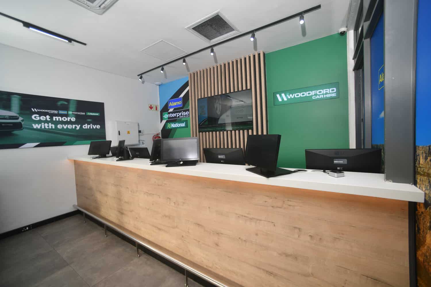 woodford car hire reception desk green branding retail interior photography durbanville