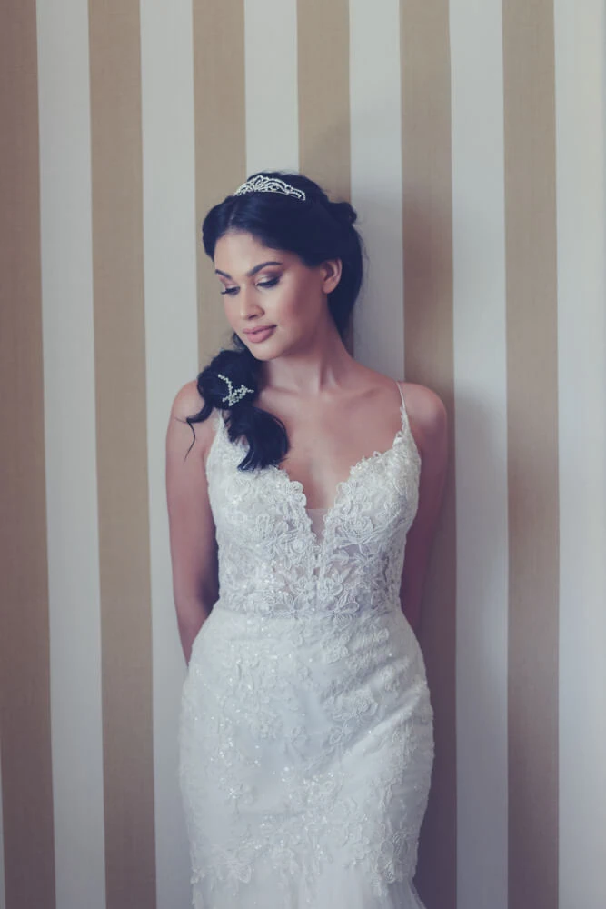 Bride tiara deep vneck lace gown striped wall – 12 Apostles Hotel & Spa, Cape Town
