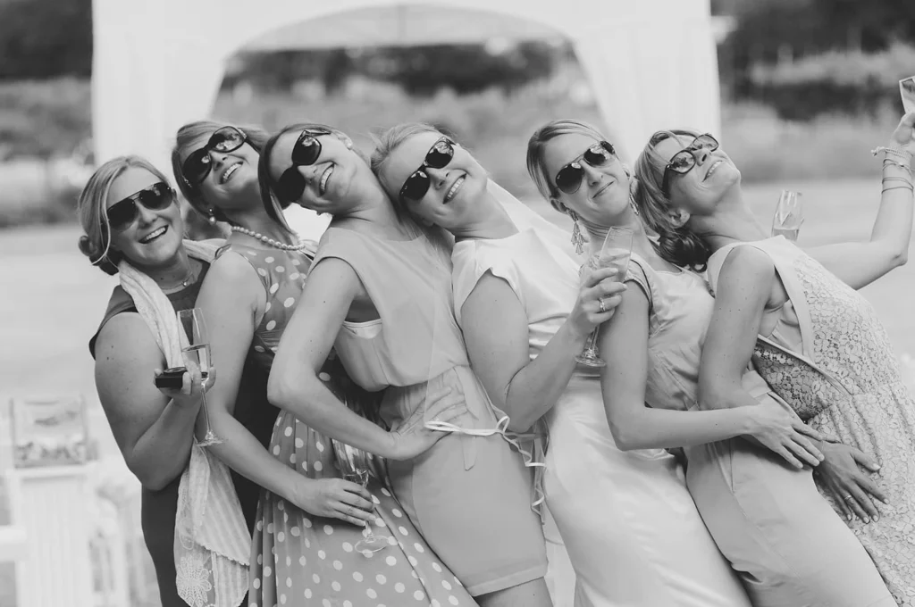 bridal party sunglasses playful pose summer