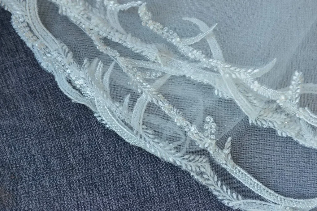 bridal veil lace edge embroidered leaf pattern macro