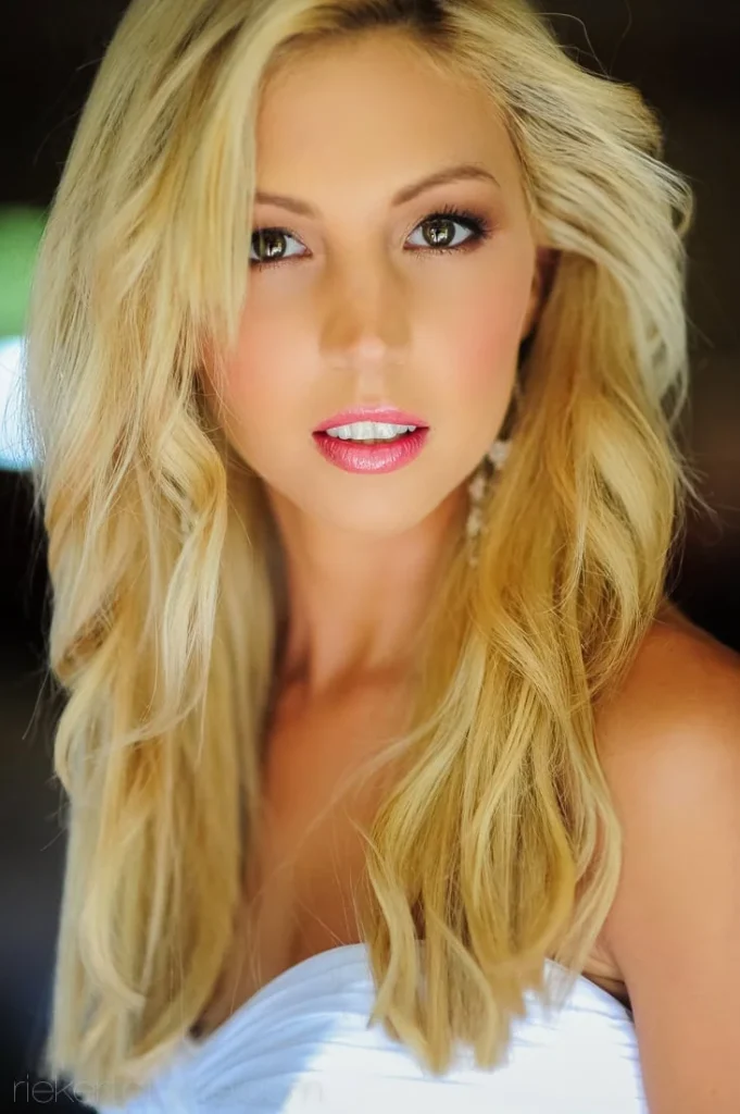 bride blonde long wavy hair strapless gown portrait