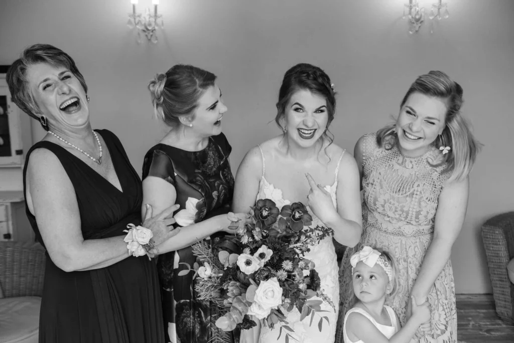 bride bridal party flower girl laughing getting ready