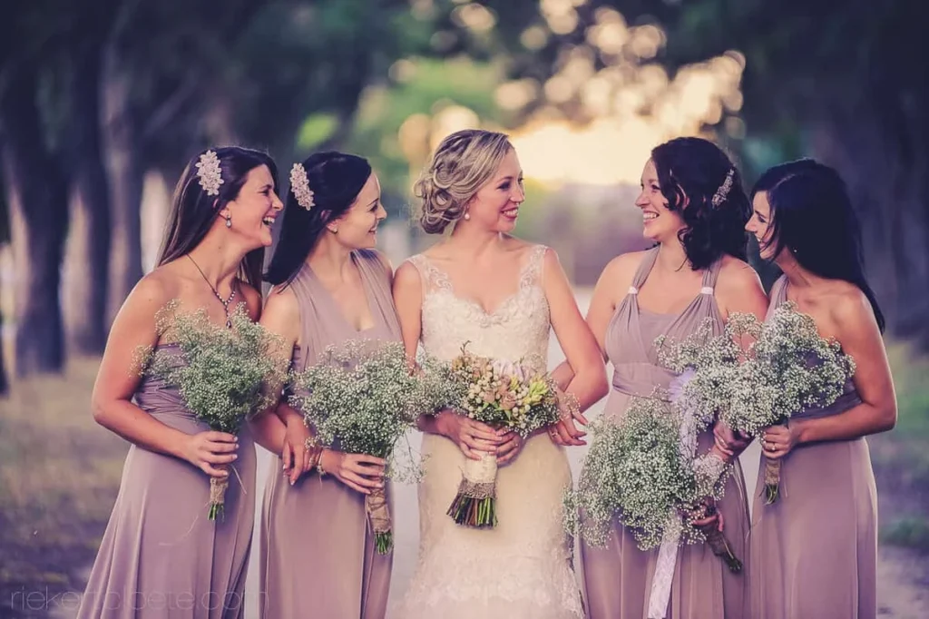 bride bridesmaids taupe dresses babys breath golden hour