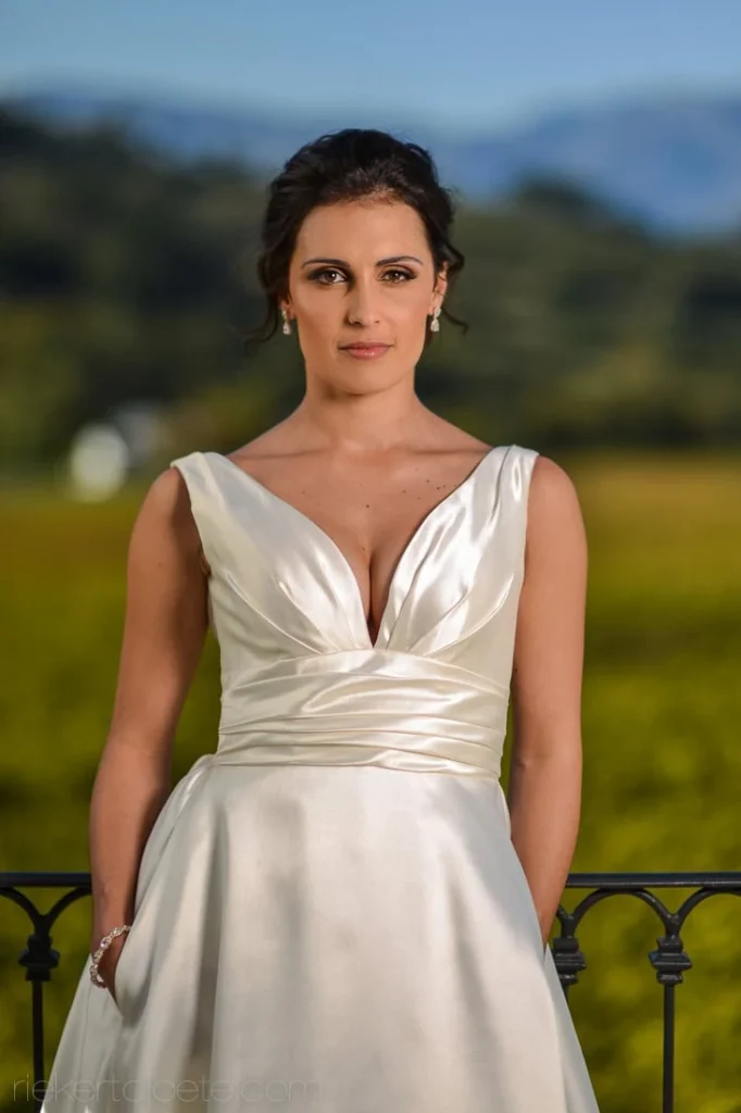 bride deep vneck satin gown vineyard golden hour