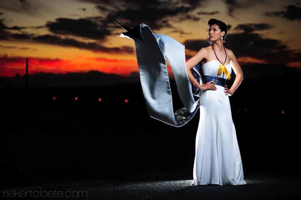 bride dramatic flowing fabric sunset sky road