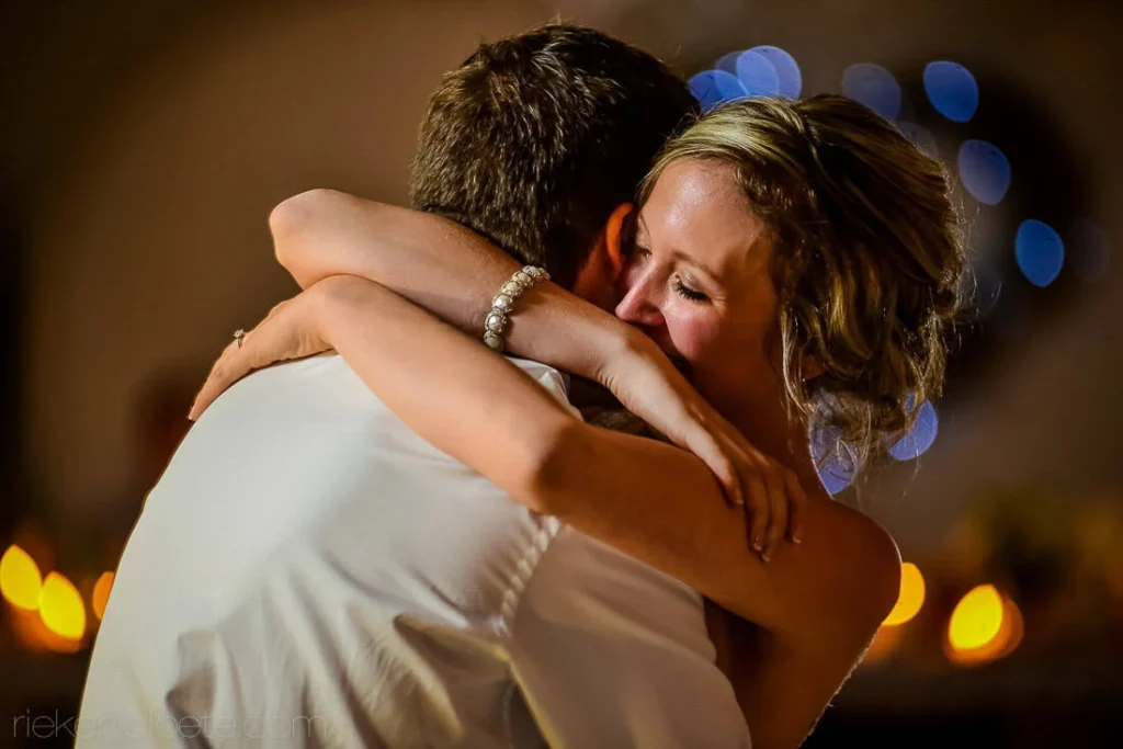 bride emotional embrace slow dance reception