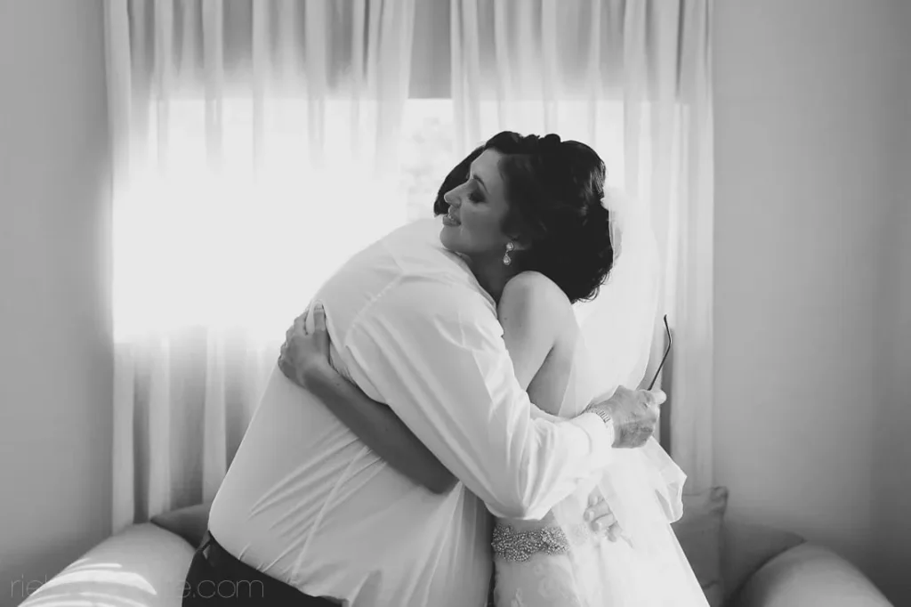 bride father emotional morning hug window light