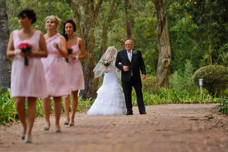 bride father walking garden ceremony procession