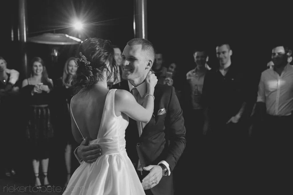 bride floral crown first dance groom brown suit
