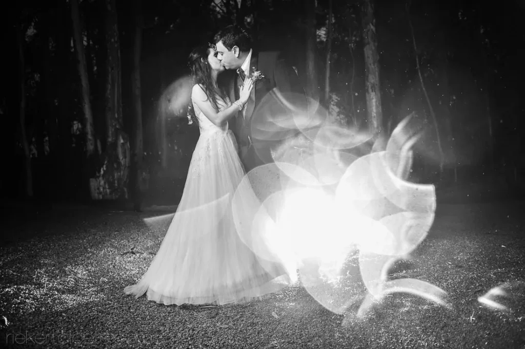 bride flowing dress light art dark forest