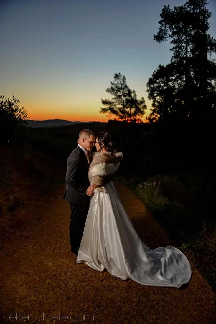bride fur wrap dirt path sunset vineyard