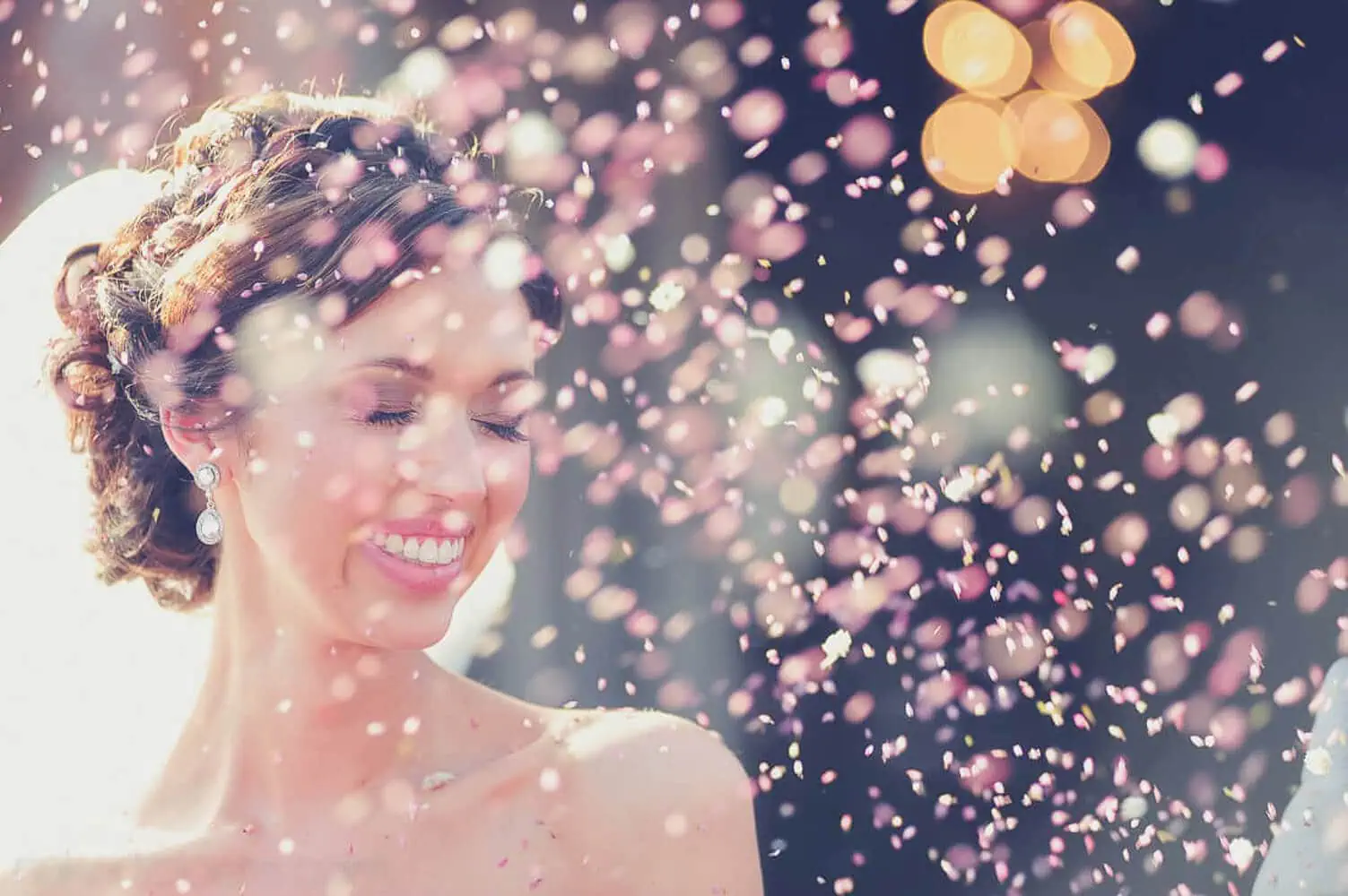 bride glowing portrait pink confetti bokeh