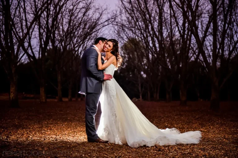 bride groom autumn leaves bare trees night