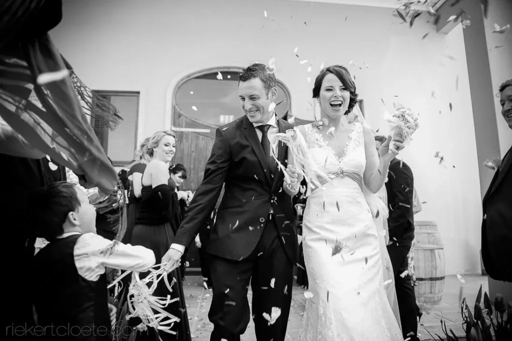 bride groom confetti ribbon exit joyful ceremony