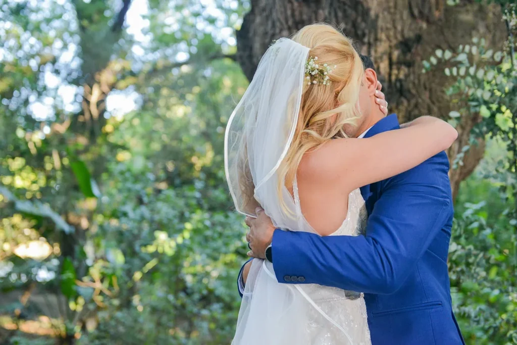 bride groom embracing under oak tree cape town