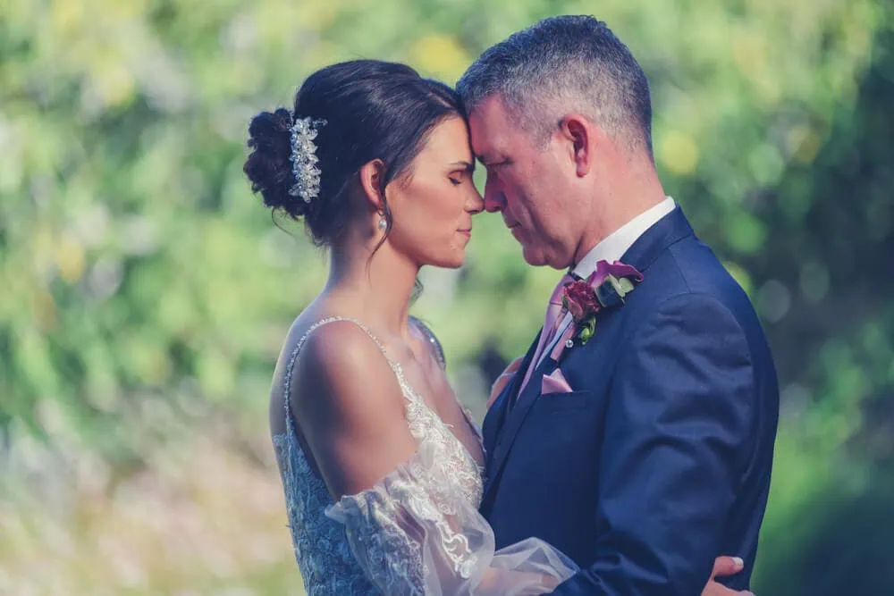 bride groom forehead to forehead garden elopement