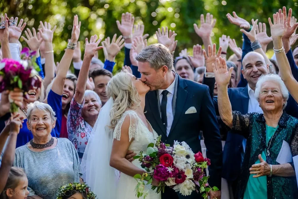 bride groom kiss cheering ceremony crowd