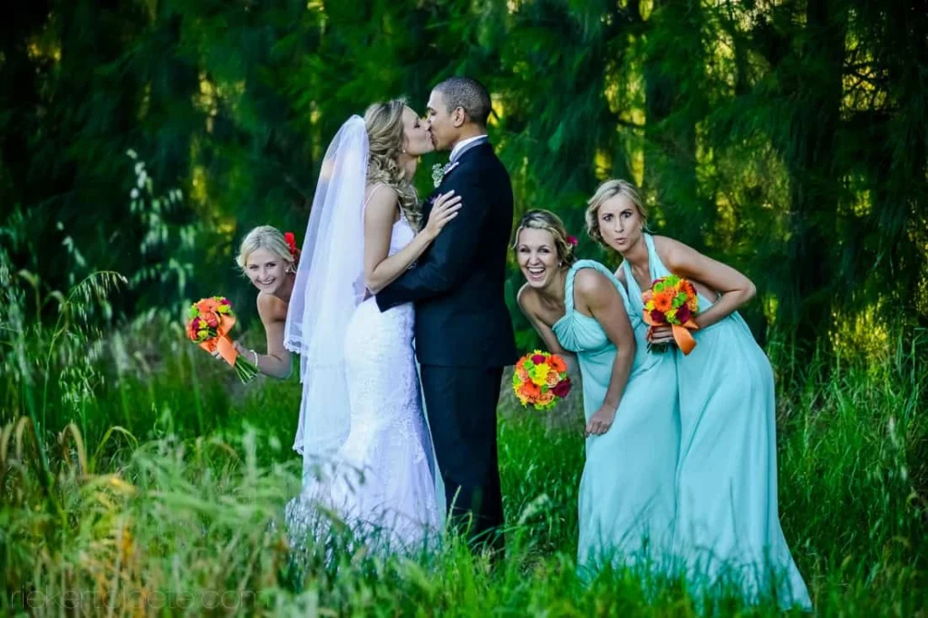 bride groom kiss teal bridesmaids garden