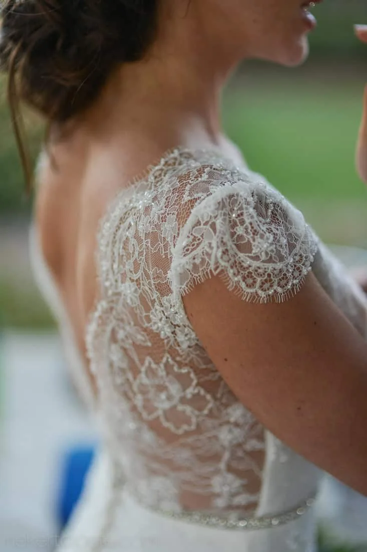 Bride lace cap-sleeve dress shoulder and back detail