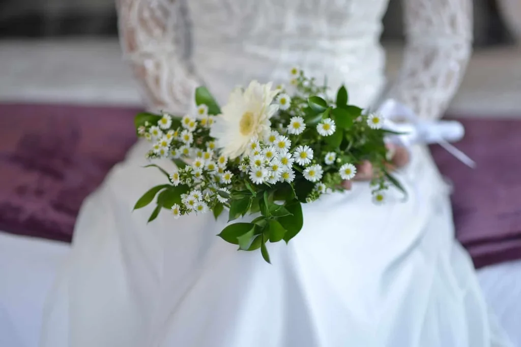 bride lace dress wildflower daisy bouquet wedding