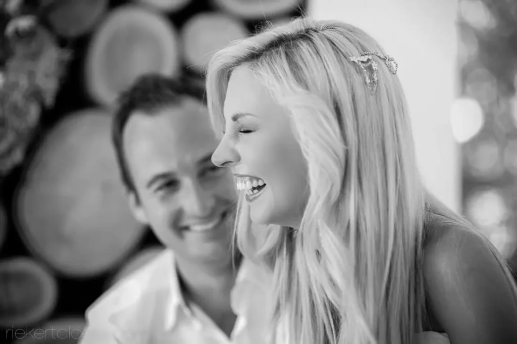 bride laughing wine cellar barrels stellenbosch