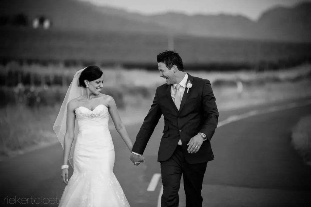 bride mermaid gown veil groom walking mountain road