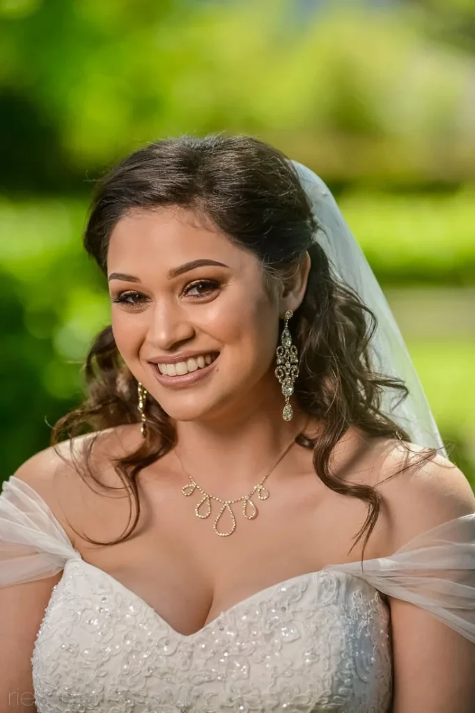 bride off shoulder beaded gown chandelier earrings garden